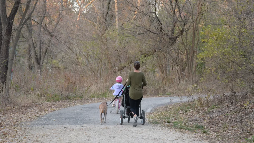 Family and dog enjoying the trail at Pheasant Branch Conservancy in Middleton, Wisconsin