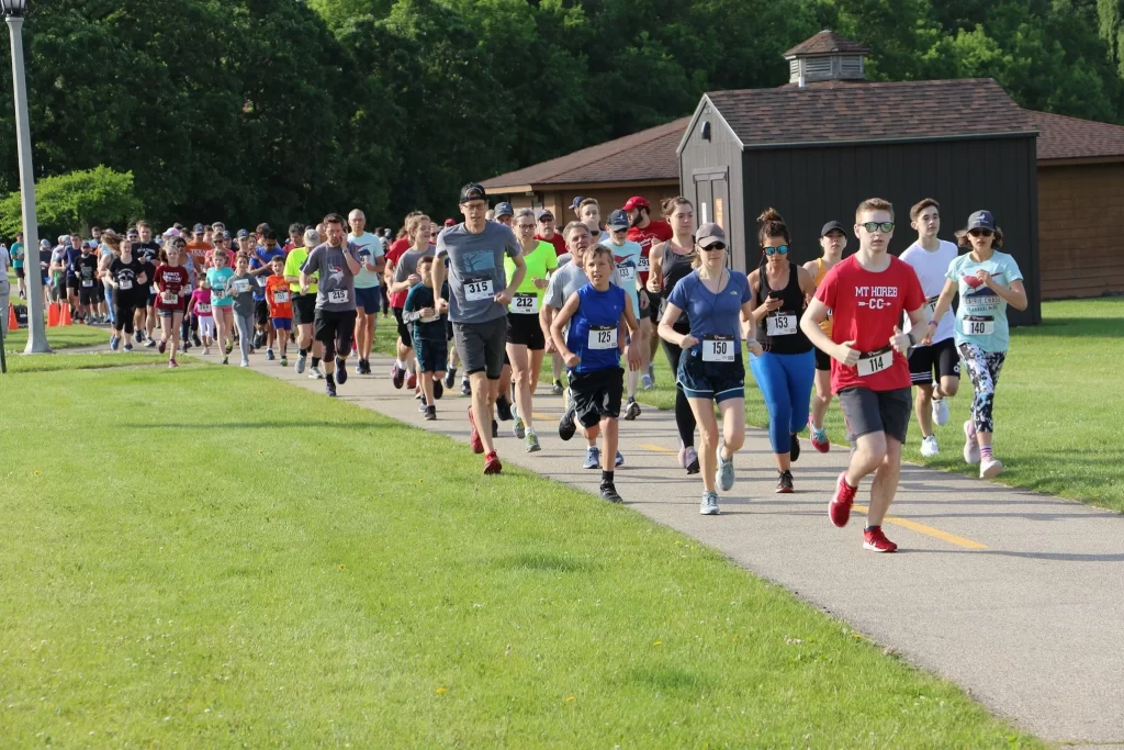 Racers begin the Prairie Chase Run/Walk at Orchard Heights Park in Middleton, Wisconsin