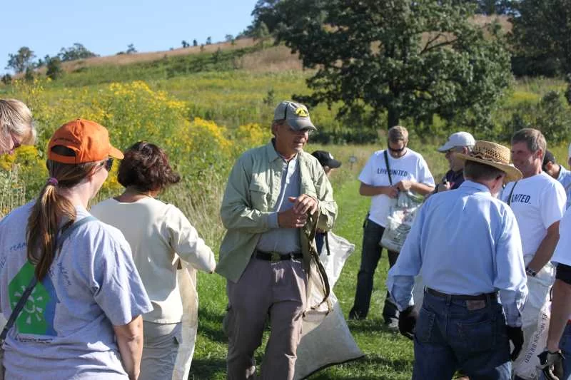 Wayne Pauly readies a United Way Day of Caring volunteer group for seed collecting