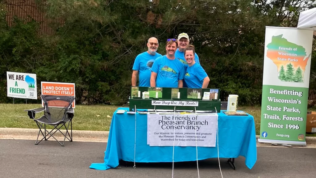 Friends of Pheasant Branch Conservancy volunteers at a National Public Lands Day event at REI in Madison Wisconsin