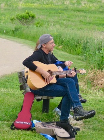 Paul Stigler playing guitar in the Conservancy