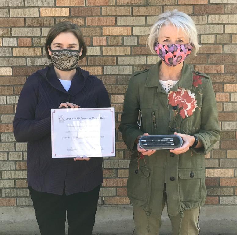 Anne Boucher, Education Coordinator and Deb Weitzel, Board member raccept a 2020 Wisconsin Association of School Boards (WASB) Business Honor Roll award