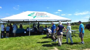 Friends of Pheasant Branch Conservancy tent at 30th anniversary Ice Cream Social in July 2025