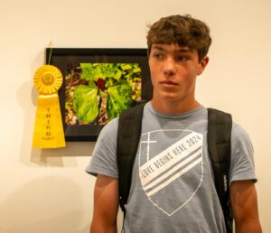Middleton High School student Leo Mastronardi with his winning photo in the annual Friends of Pheasant Branch photo contest