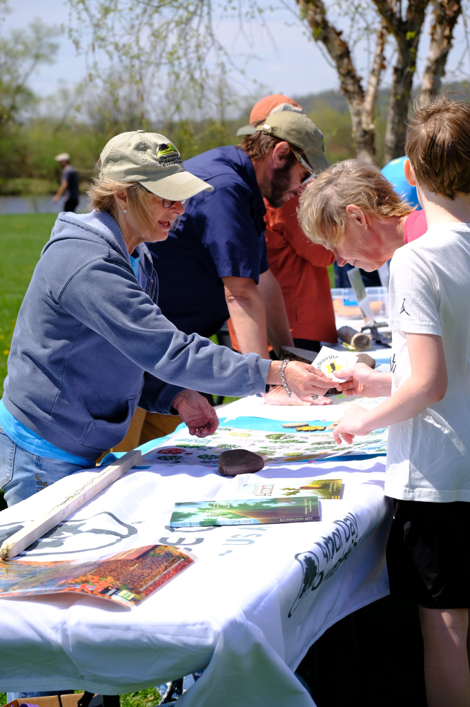 Members of the Friends of Pheasant Branch Conservancy share information at the Celebrating Books and Trees event at Orchid Heights Park in Middleton Wisconsin
