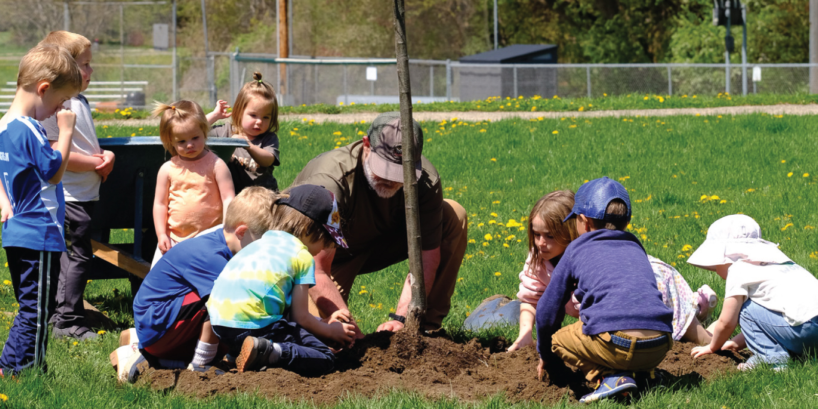 Tree planting at Celebrating Books & Trees event at Pheasant Branch Conservancy