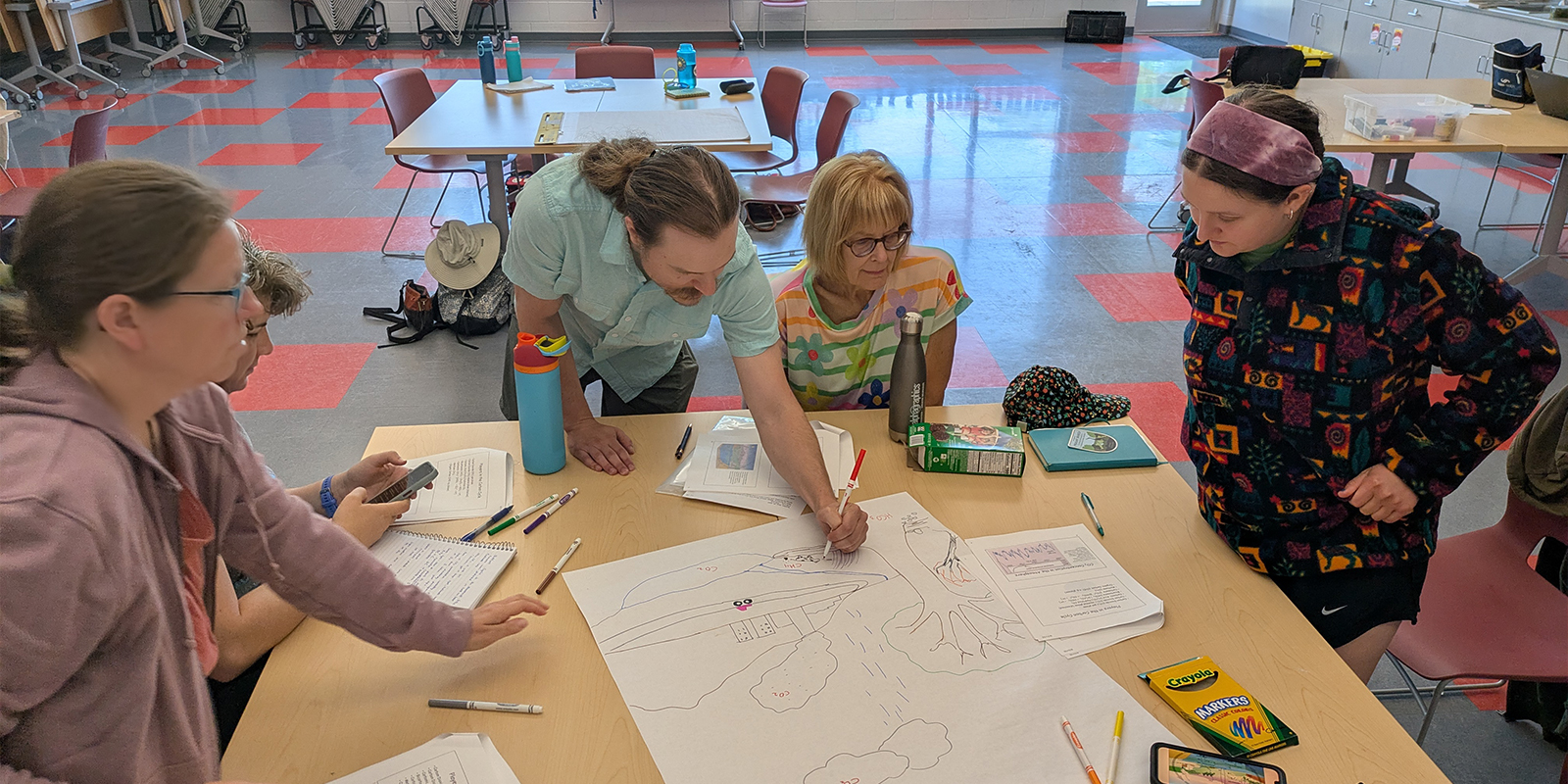 Friends of Pheasant Branch Conservancy volunteers working in a classroom